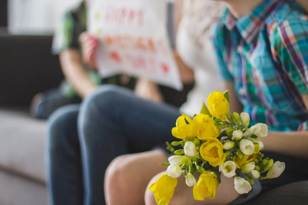 Yellow bouquet held in a seated healthcare waiting area